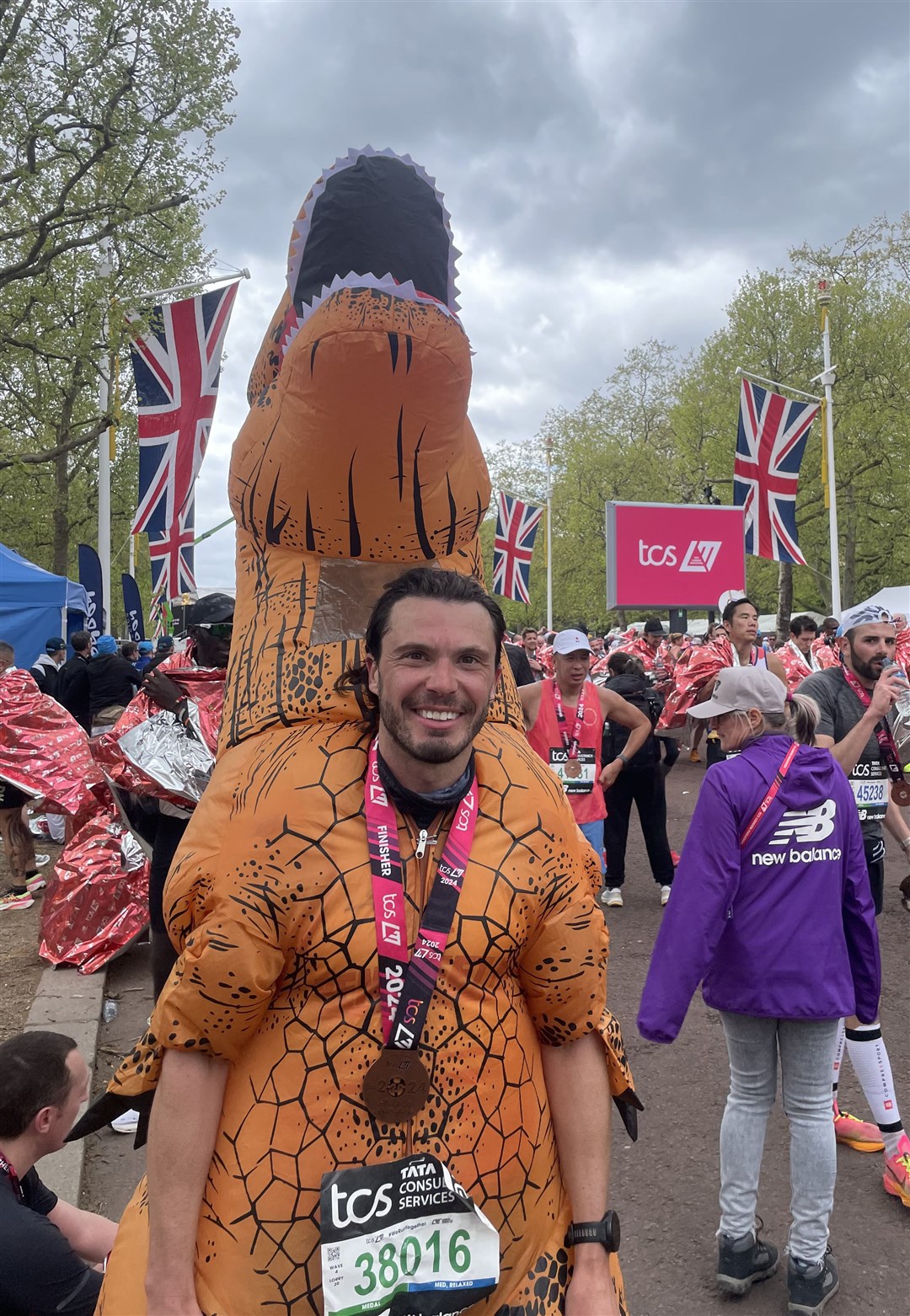 Lee Baynton after finishing the TCS London Marathon dressed in an inflatable costume (Samuel Montgomery/PA)