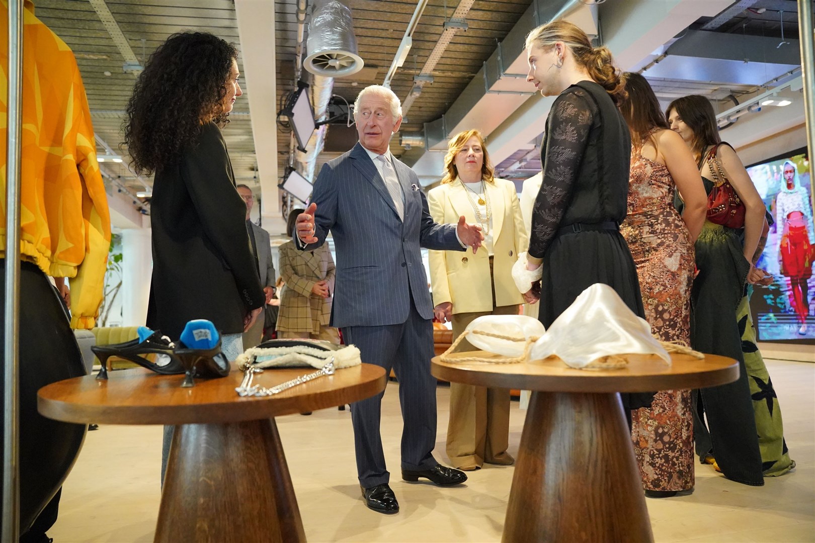 The King speaks to designers during the event (Jonathan Brady/PA)