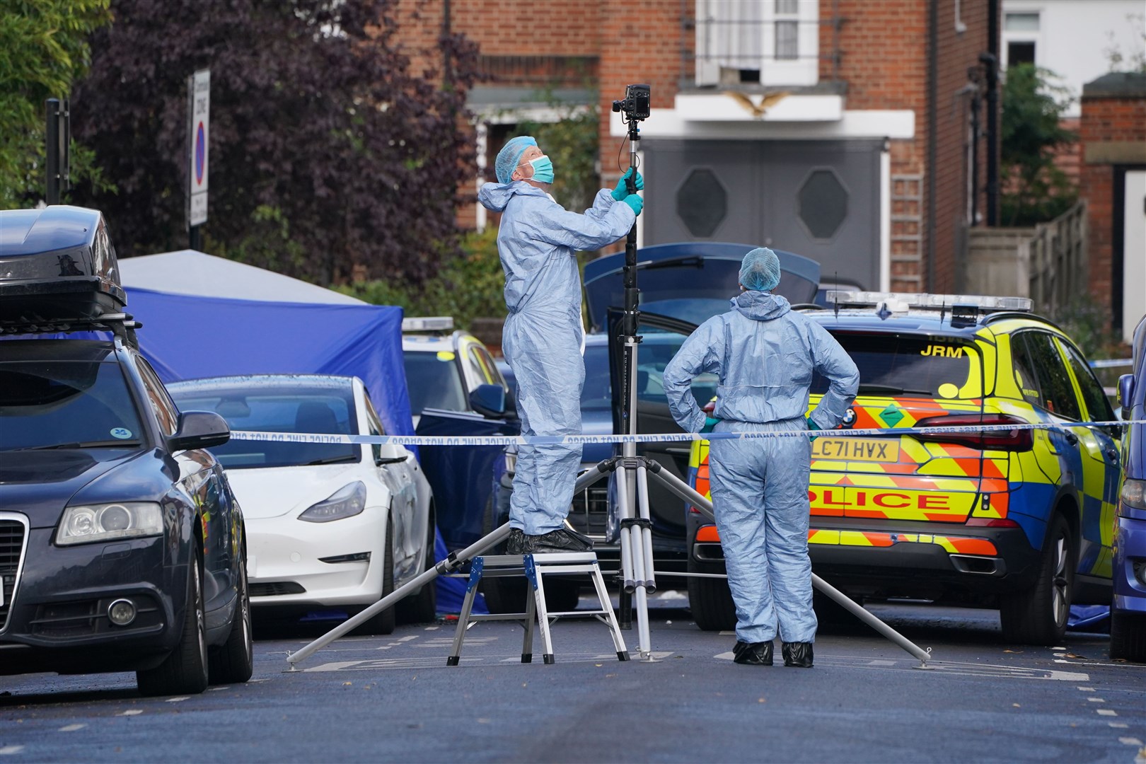 Forensic officers at the scene following the shooting (Jonathan Brady/PA)