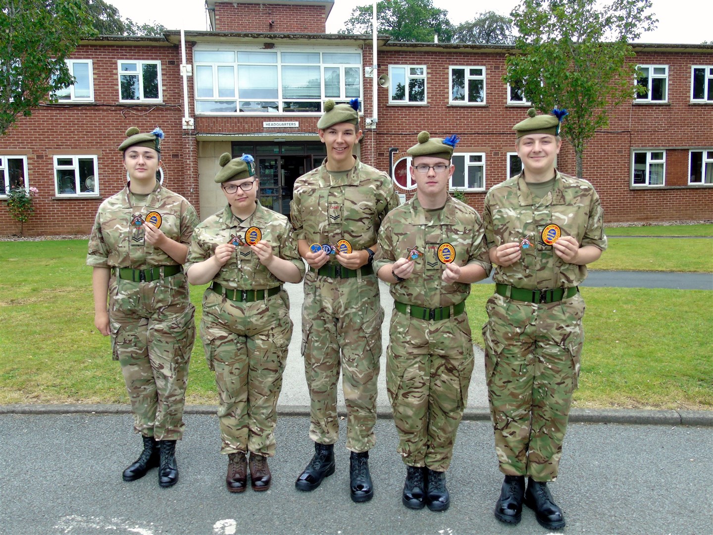 Inter Service Cadet Rifle Team showing off their badges (from left) Cpl Goodman, Cpl Calder, Cpl Tait, Cpl Hayllar and Cpl Bialkowski.