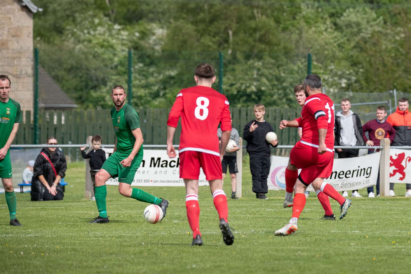 Forres Thistle's Matthew Davidson strikes a late free kick, which deflects off Dufftown stopper Michael Dunn into the net. ..Dufftown FC (2) vs Forres Thistle FC (2) - Dufftown FC win 5-3 on penalties - Elginshire Cup Final held at Logie Park, Forres 14/05/2022...Picture: Daniel Forsyth..