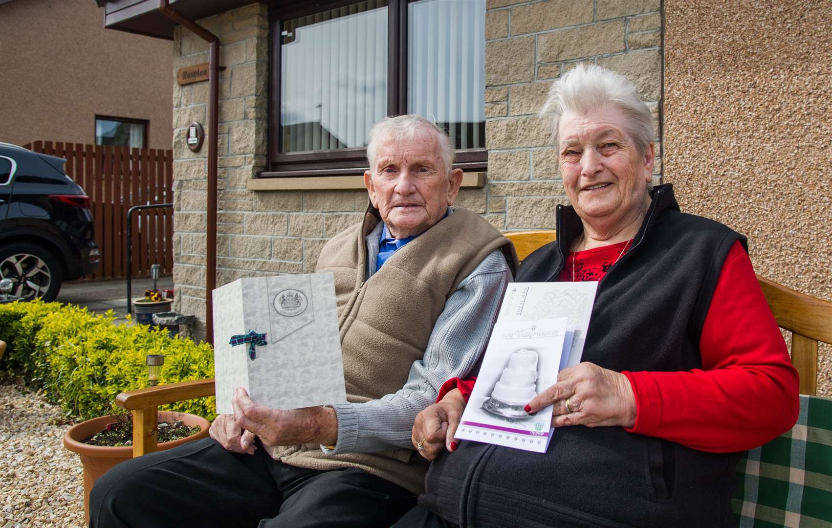 Bill and Helen Simpson, from Elgin, with some of the special cards they received on their diamond wedding anniversary on Thursday, April 29. Picture: Becky Saunderson.