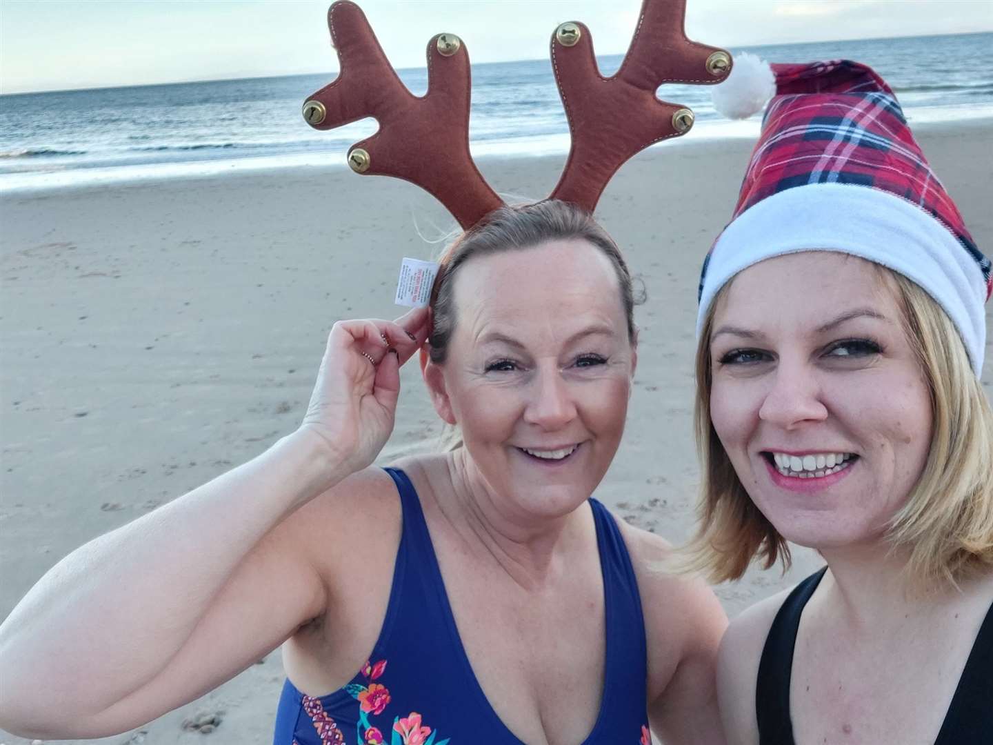 Louise Foy (left) and Sarah Roger have fun at Christmas.