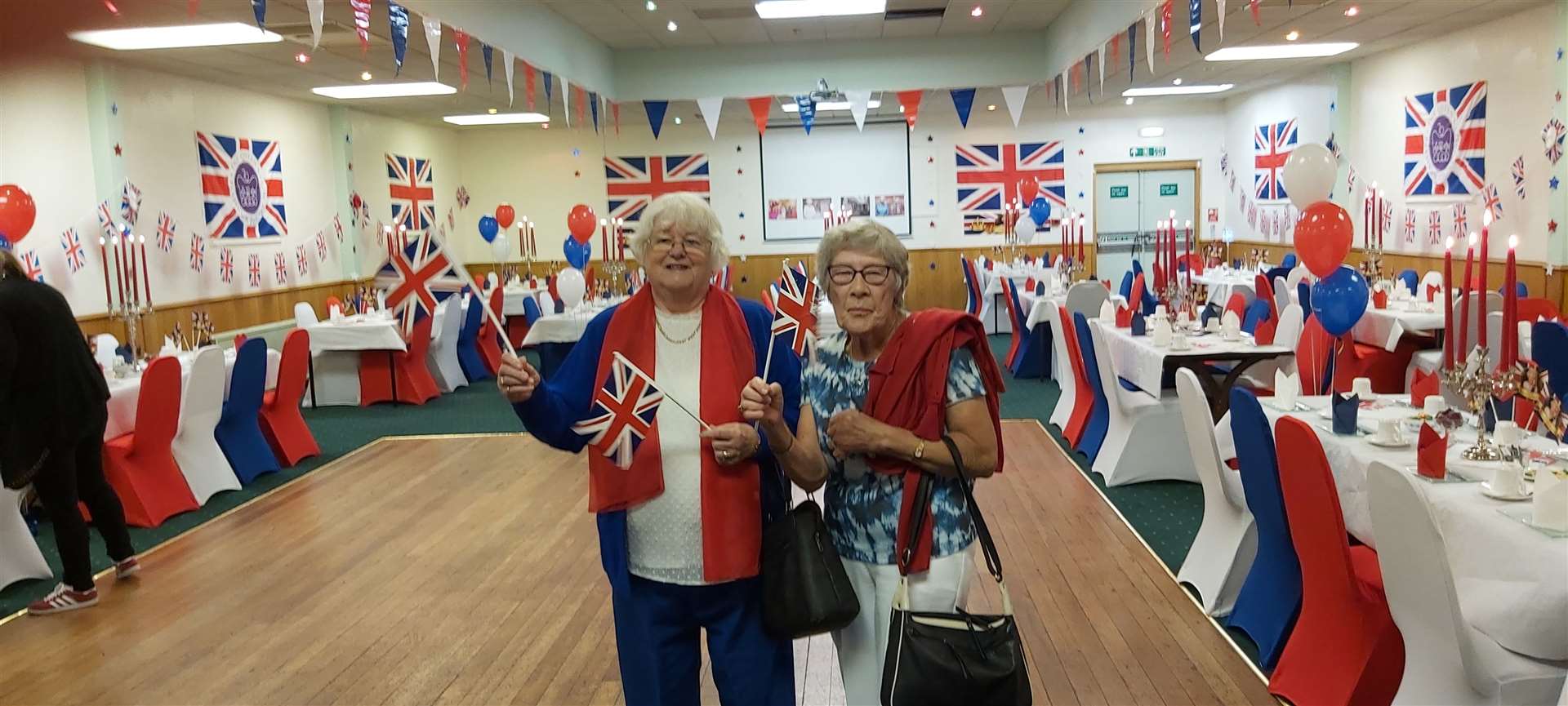 Dressed in red, white and blue, Margie Cameron (left) and Frances Burton.