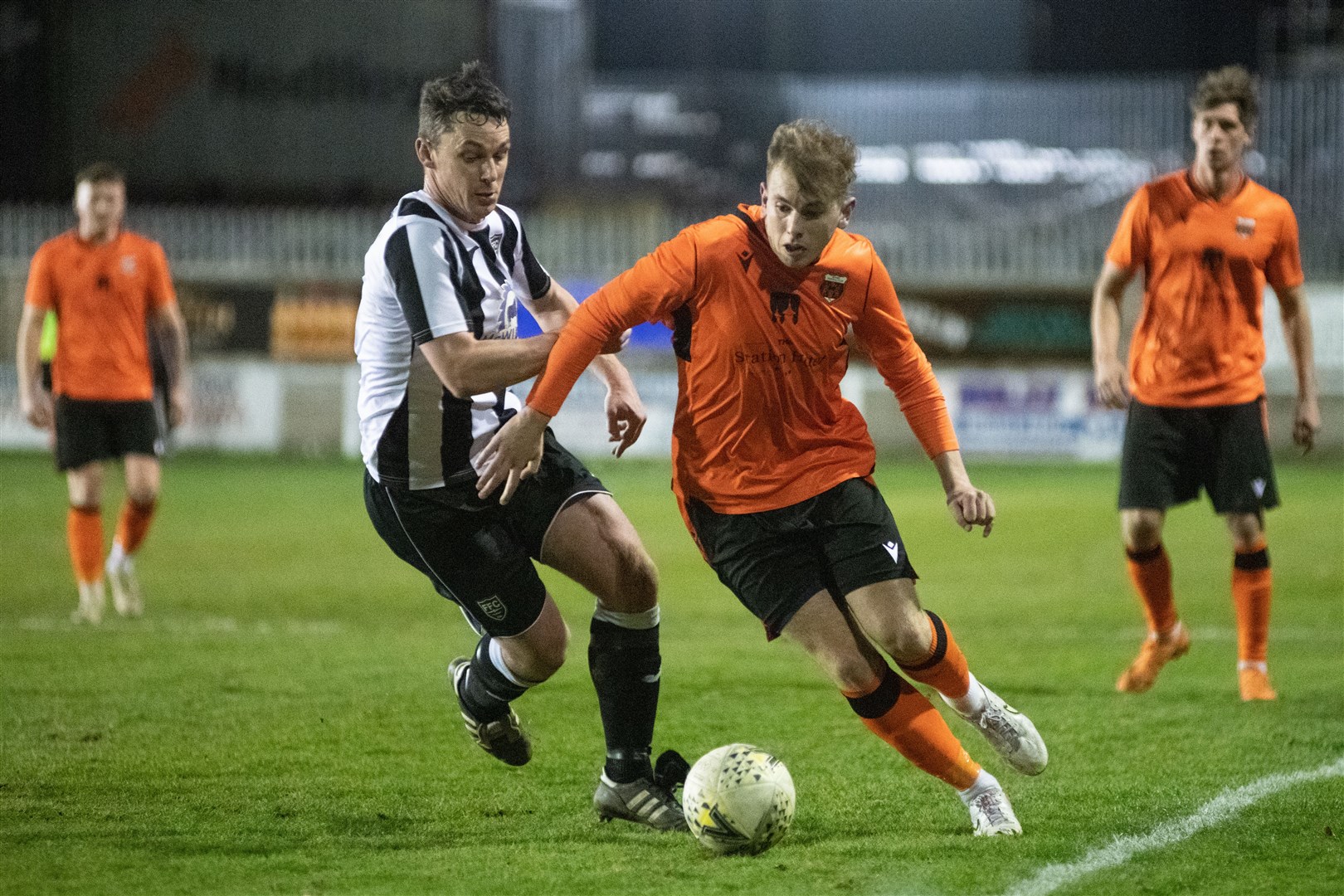 Rothes' Fraser Robertson plays away from Fraserburgh's Grant Campbell. Picture: Daniel Forsyth..