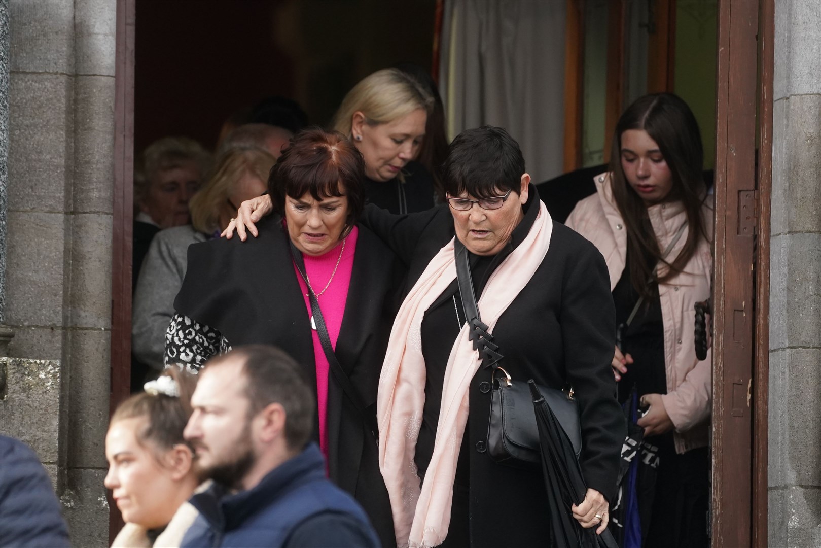 Mourners leave the church after the service (Brian Lawless/PA)