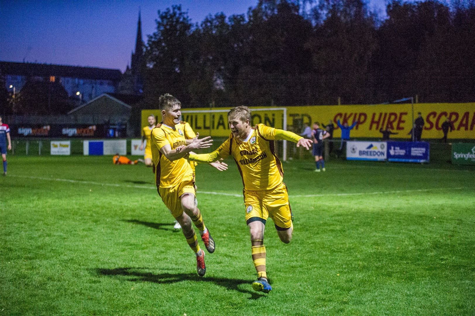 Robbie Duncanson (right) charges towards the home dugout to celebrate his winning goal. Forres Mechanics v Turriff United at Mosset Park...Picture: Becky Saunderson..
