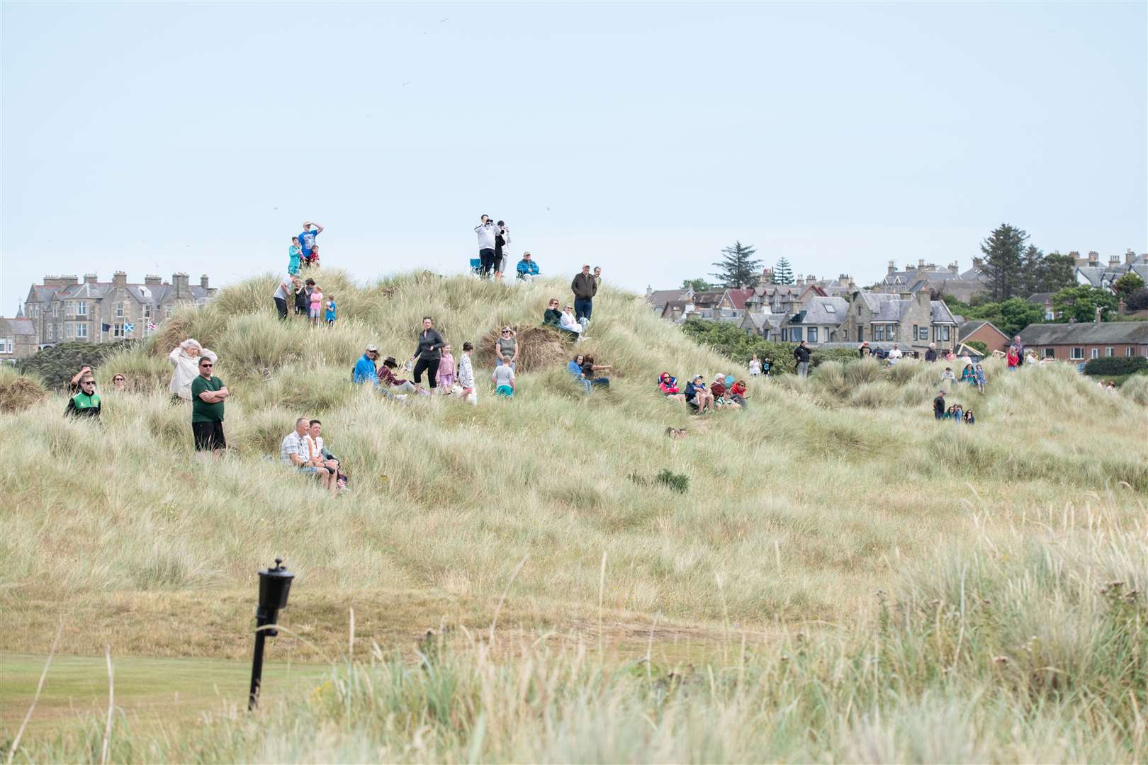 Spectators watch both the golf and the airshow at RAF Lossiemouth. Picture: Daniel Forsyth..