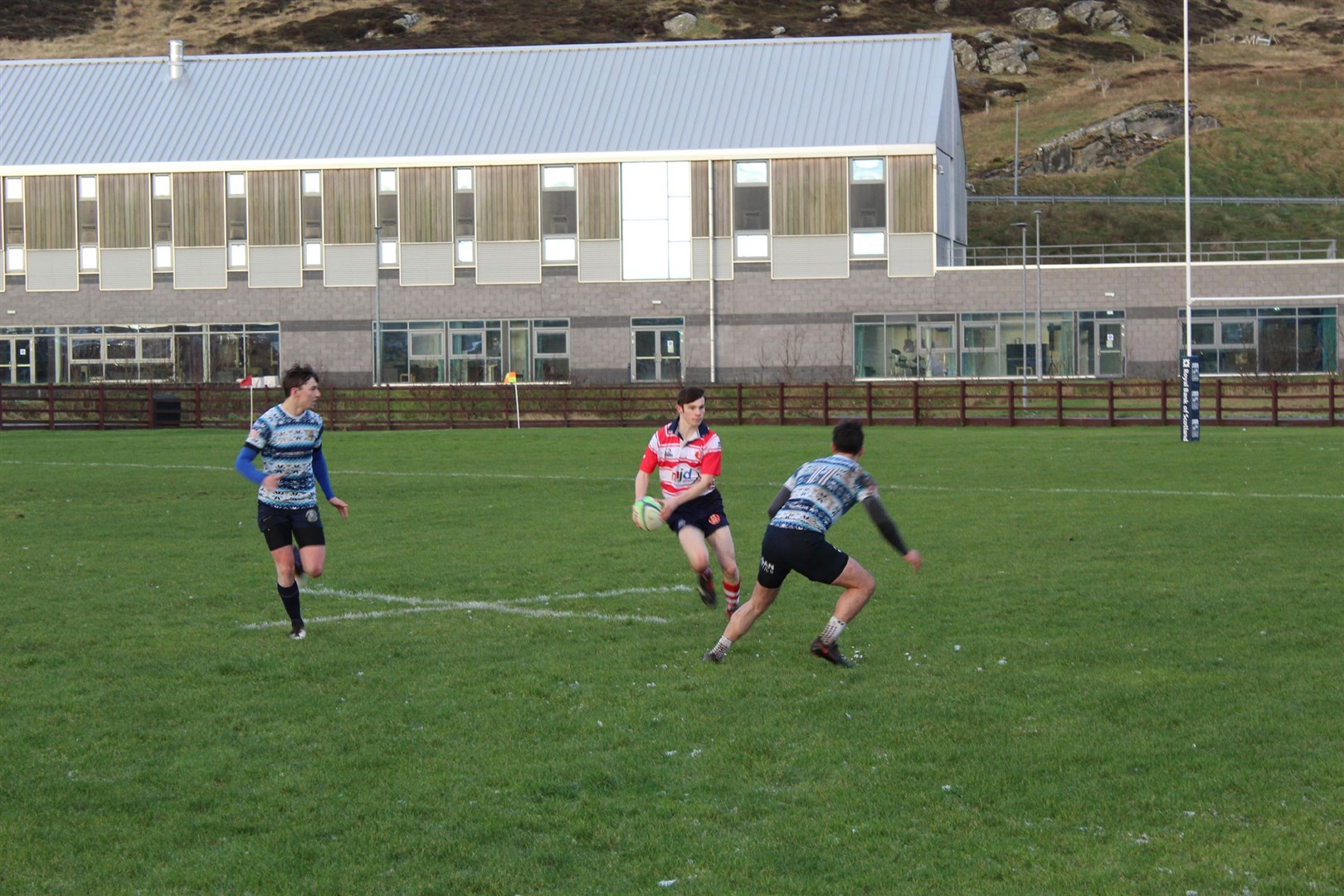 Lewis Hay looks to open the ball out for Moray. Photo: Grant Mitchell