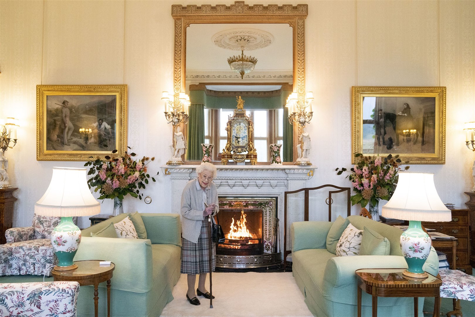 In one of the last official photographs ever taken of the monarch, the Queen waited to greet new Prime Minister Liz Truss at Balmoral in September (Jane Barlow/PA)