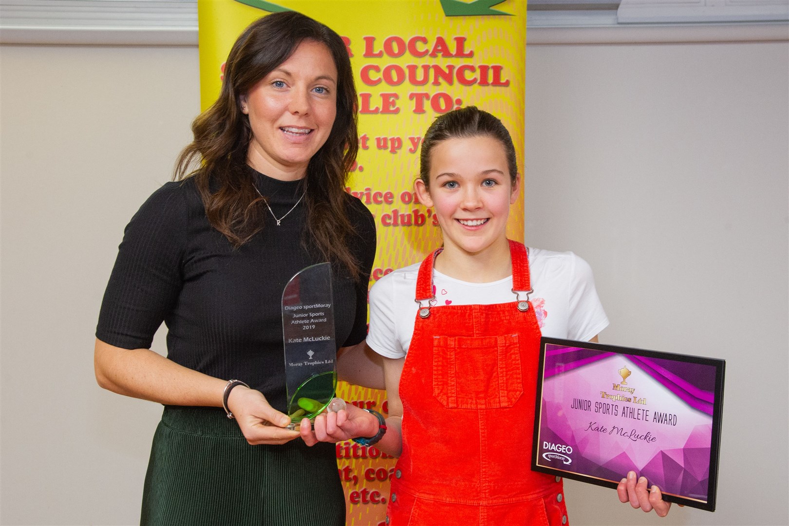 Rachel Corsie presented orienteer Kate McLuckie, from Elgin, with her award for Junior Sports Athlete of the Year. Picture: Daniel Forsyth