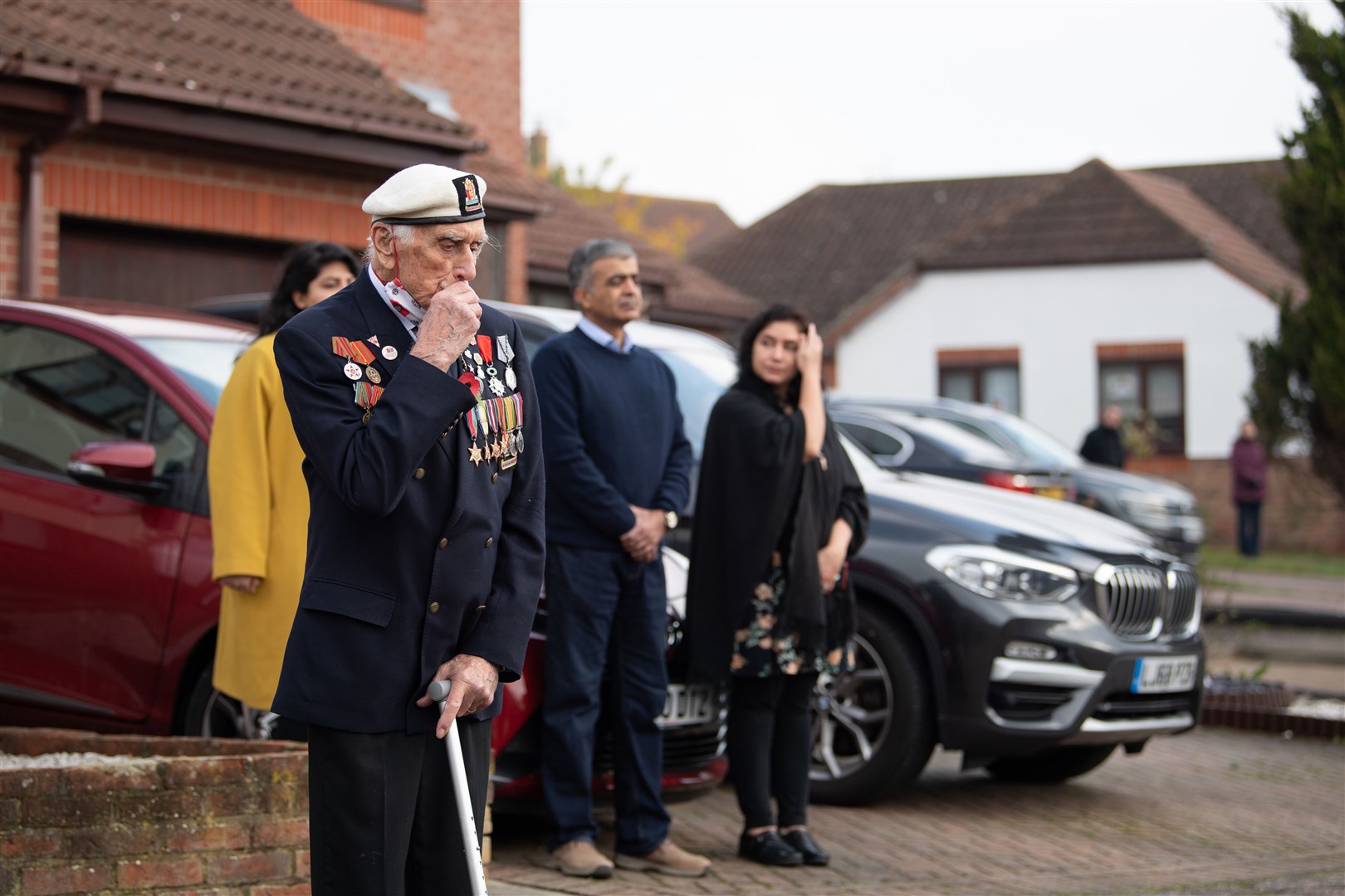 Seymour ‘Bill’ Taylor, 95, from Colchester in Essex, who served as an Able Seaman in the Royal Navy onboard HMS Emerald during the D-Day landings, joins neighbours in the street to pay respects (Joe Giddens/PA)