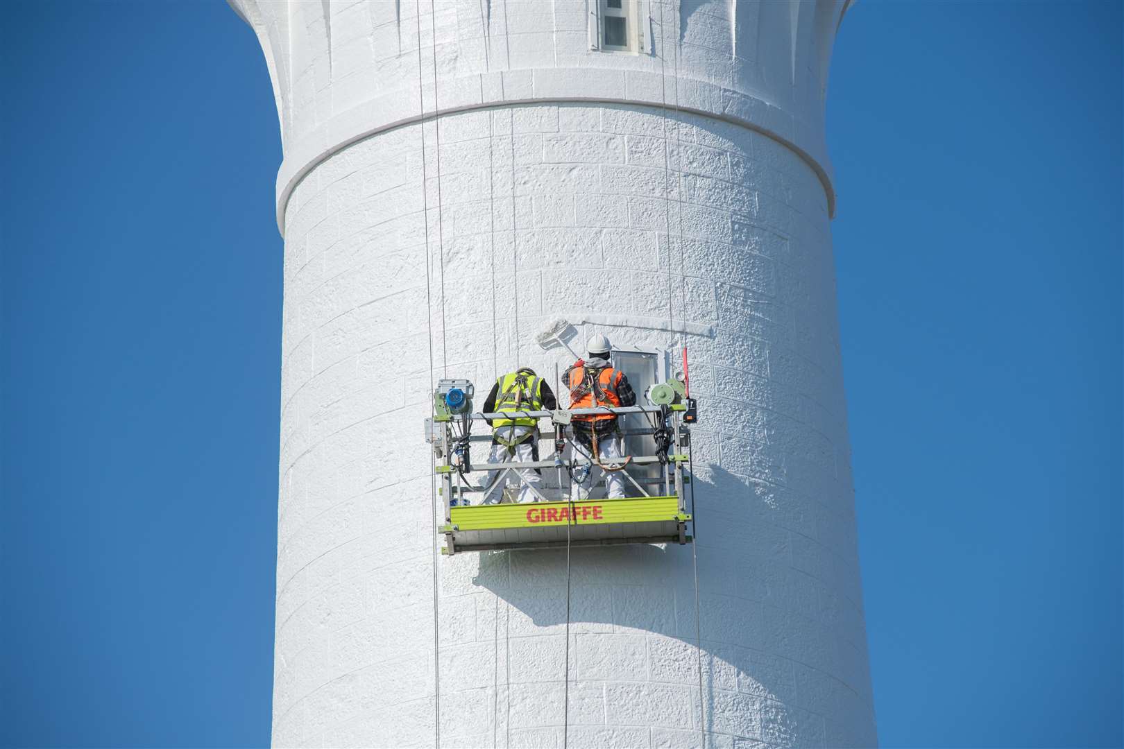 The workers from Edinburgh Painting Contractors were grateful for the nice weather, which meant they could finish the job on time. Picture: Daniel Forsyth