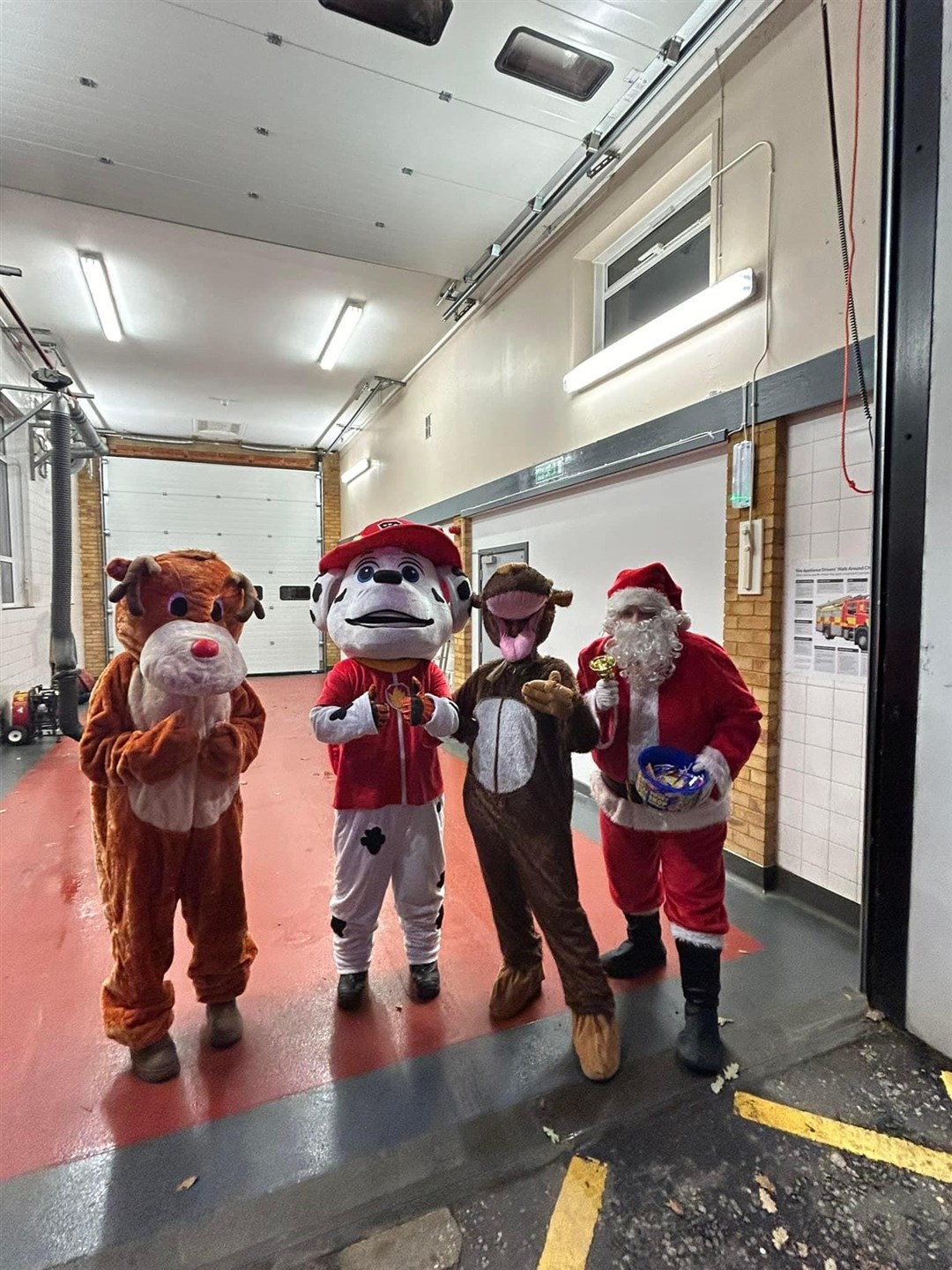 Santa, Marshall from Paw Patrol and a couple of reindeer get ready to hit the road for the Christmas charity street collection. Picture: Fochabers fire station