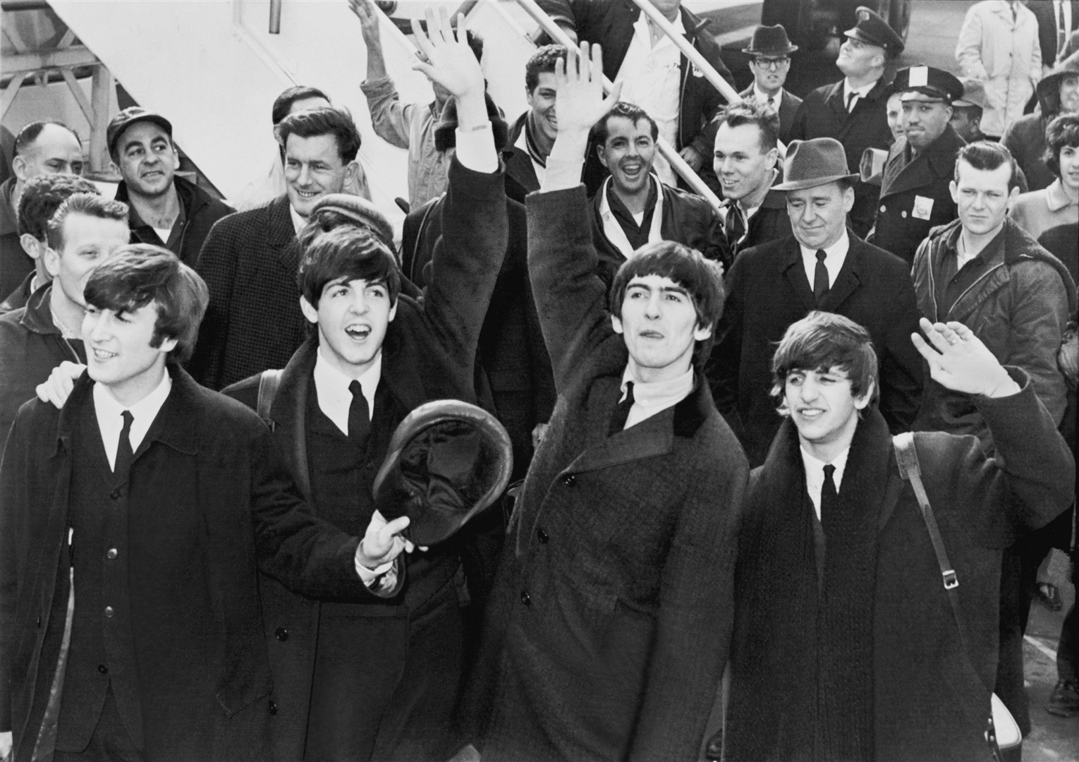 The Beatles arrive and conquer America