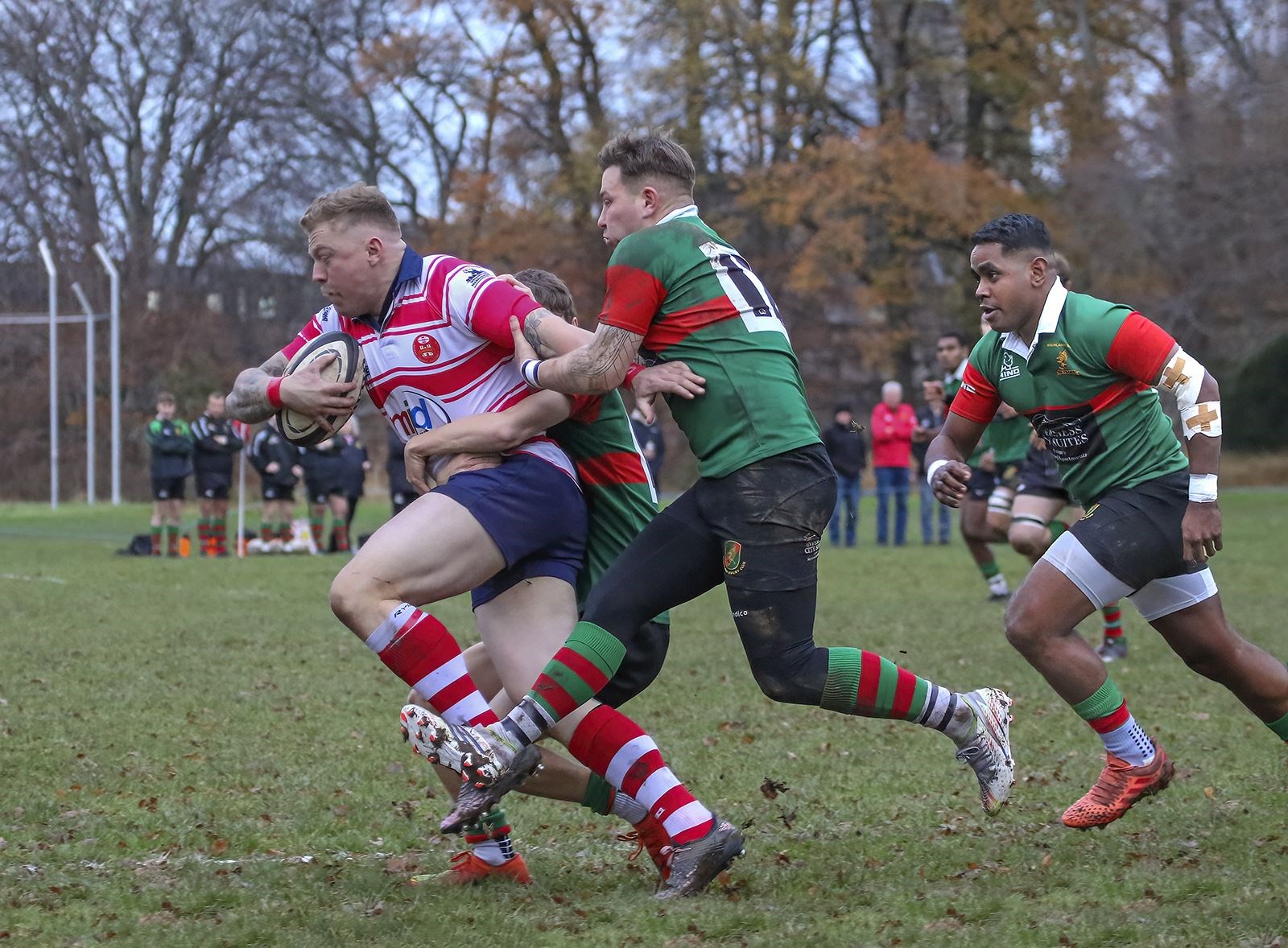 Defenders desperately trying to hold on to Lewis Scott. Picture: John MacGregor