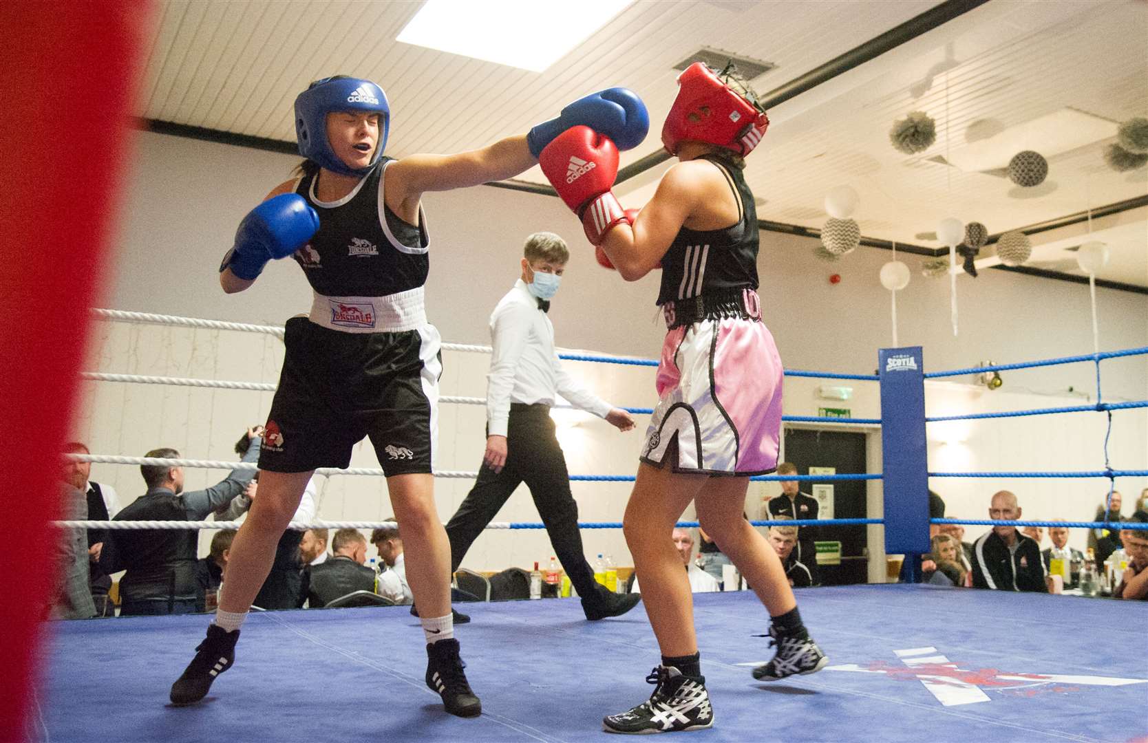 Josie Walls aims a punch at Commonwealth Games boxer Megan Gordon in what turned out to be an exciting women's exhibition bout. Picture: Becky Saunderson..