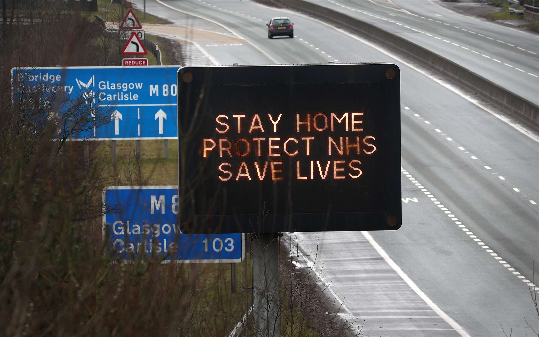 A road sign advising drivers to stay home, protect NHS, saves lives (Andrew Milligan/PA)