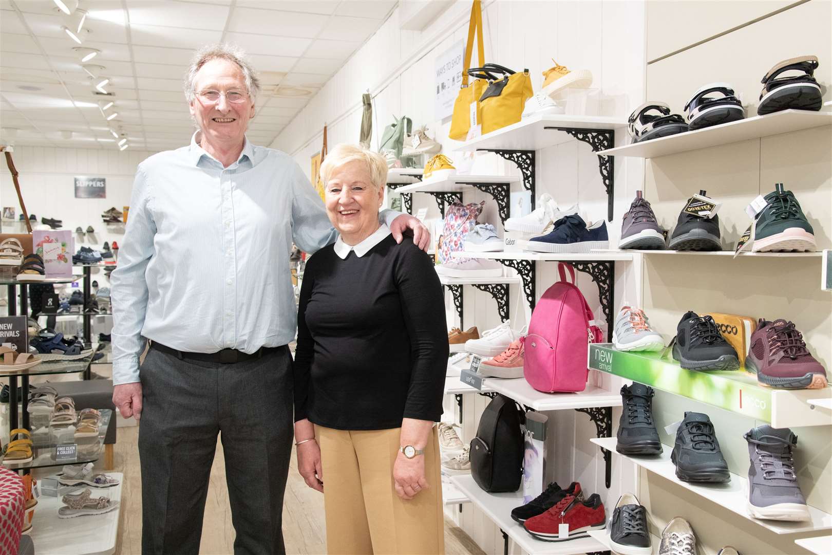 Alan Reid and Annita Brown...Long-serving members of staff are rewarded for their service at Elgin shop Begg's Shoes and Bags...Picture: Daniel Forsyth..