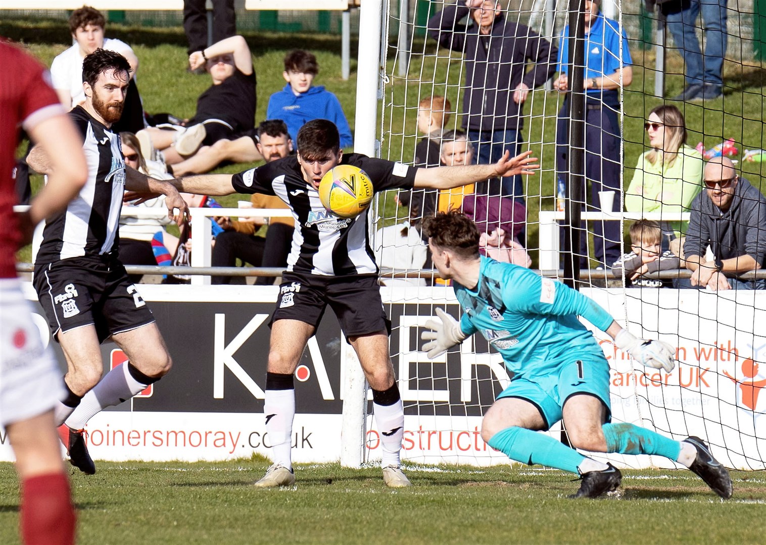 Kane O`Connor clears the ball away from the Elgin goal. Photo: Bob Crombie