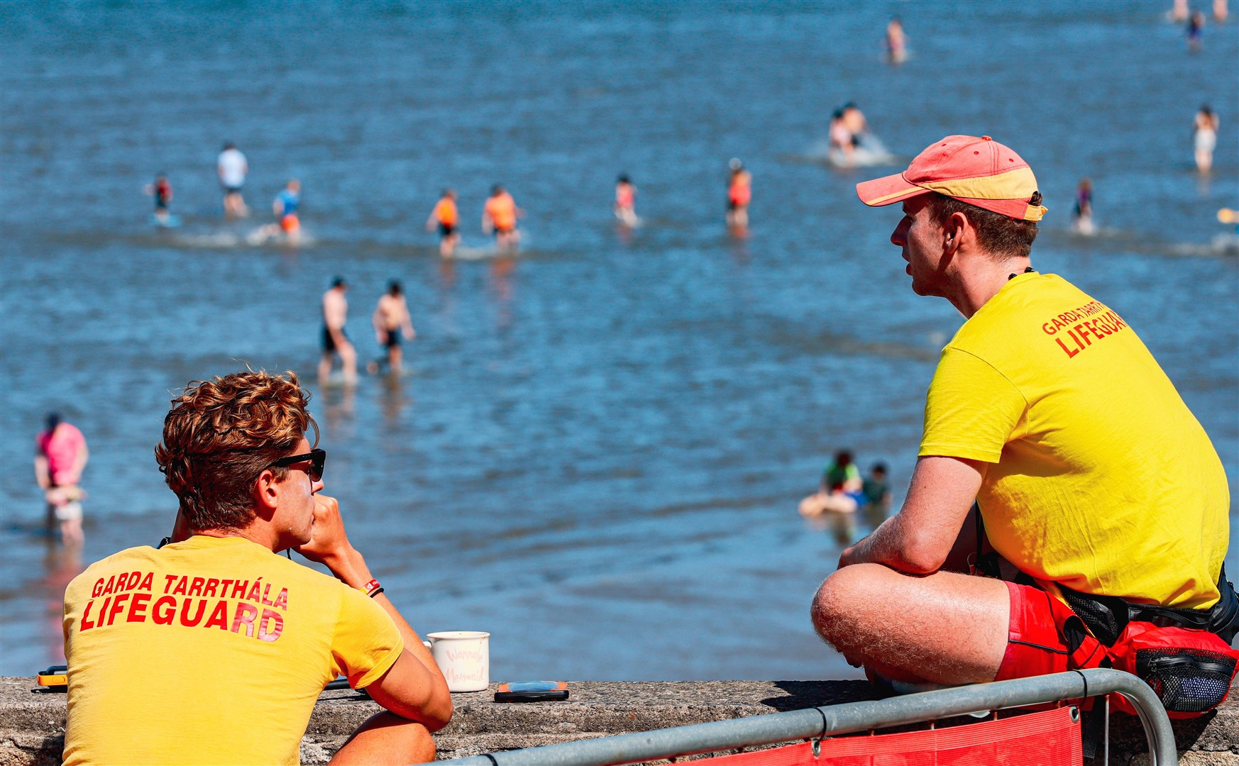 Lifeguards keep a lookout during good weather at Seapoint beach in South Dublin (Damien Storan/PA)