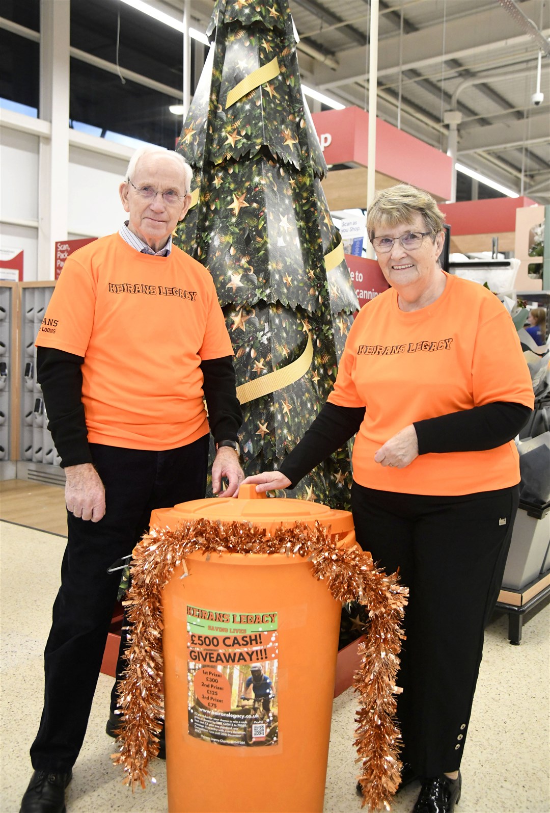 Keiran's Granda and Nanna, Robbie and Barbara Dalgarno before announcing the winners for the raffle for Keiran's Legacy...Keiran's Legacy raffle in Tesco, Elgin...Picture: Beth Taylor.