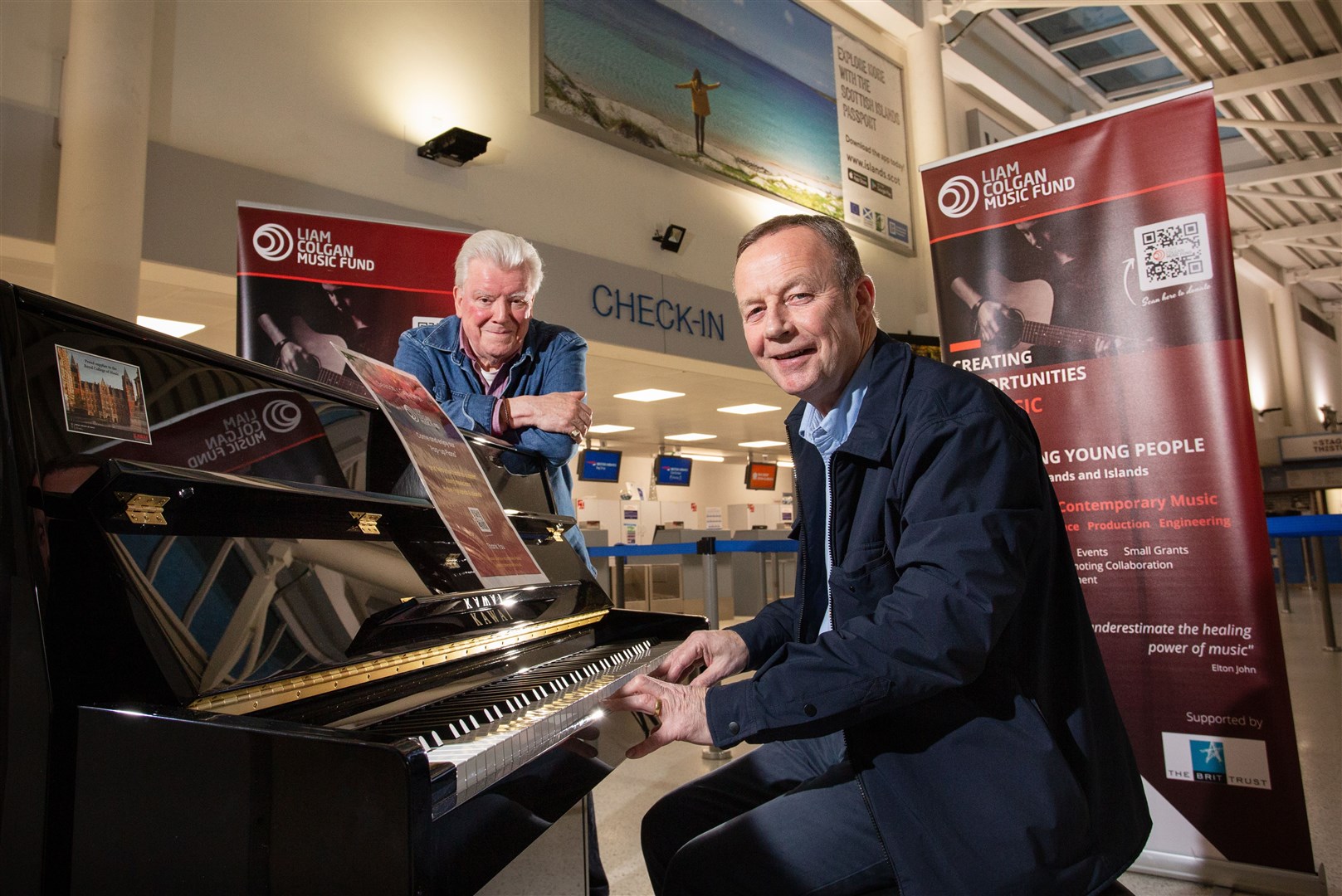 Iain Clark and Brian Colgan – both of the Liam Colgan Music Fund – at Inverness Airport. Picture: Alison White Photography
