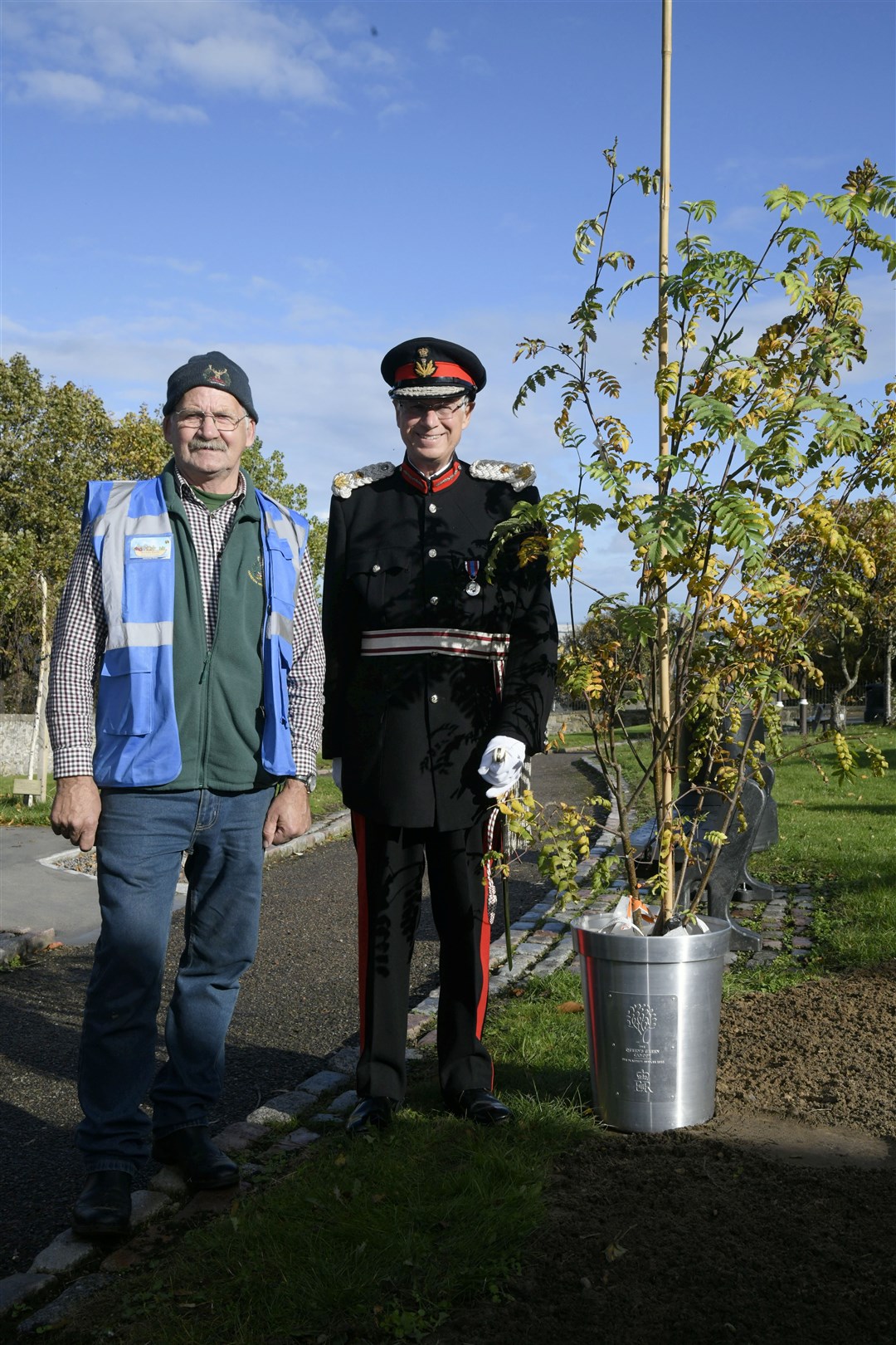 The Lord Lieutenant of Banffshire Andrew Simpson (right) admires the 'Tree of Trees' presented to Buckie's Roots along with group volunteer Archie Jamieson. Picture: Beth Taylor