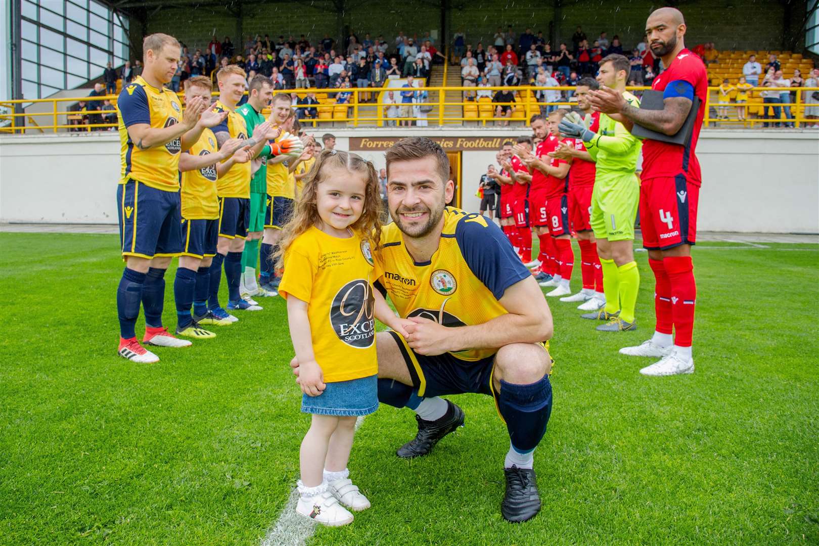 Ross MacPherson walked out with daughter Jesśe to a guard of honour for his ten-year service to the Can Cans. .Picture: Daniel Forsyth.