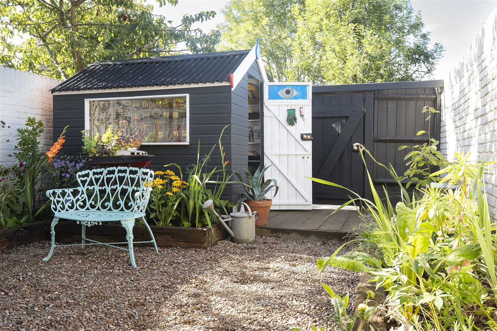 The winning shed’s exterior is painted black in contrast to its bright interior (PinPep Cuprinol Shed of the Year/PA)