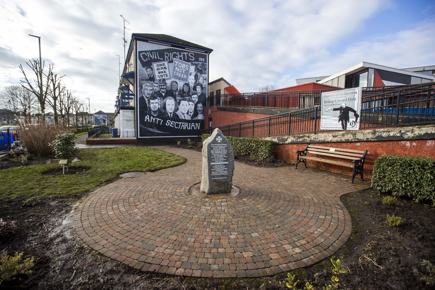 The Bishop Edward Daly Garden of Reflection beside the civil rights mural in Derry’s Bogside (Liam McBurney/PA)