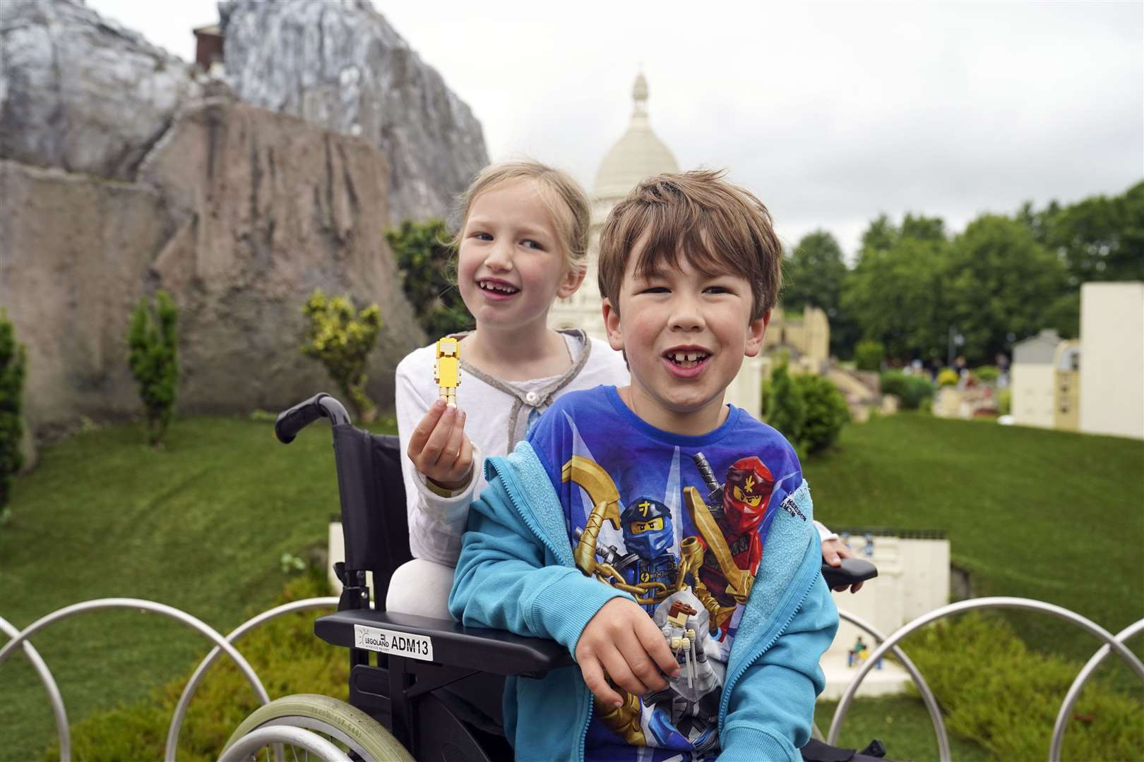 Sebby Brett with his sister Lottie during a visit to Legoland (PA)