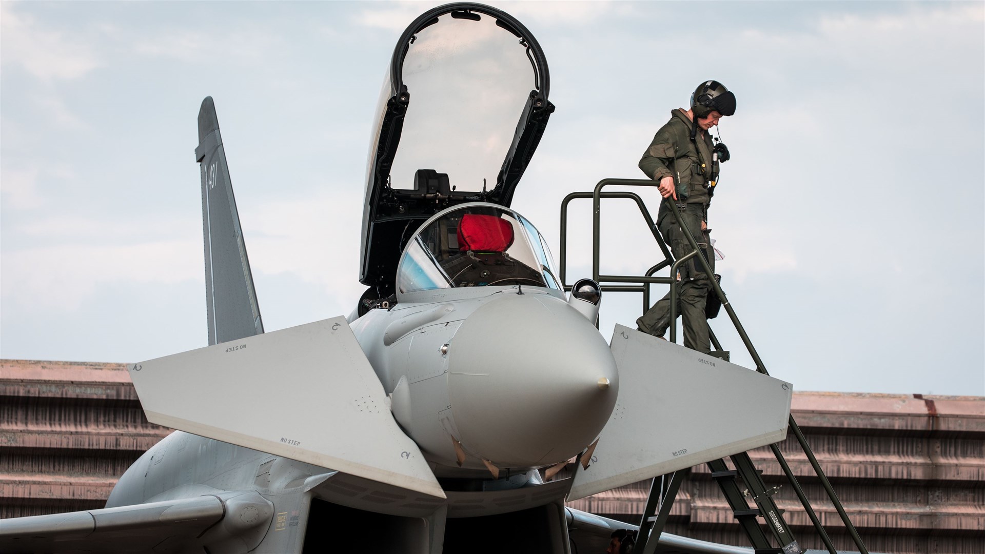 A Royal Air Force Typhoon pilot exits his aircraft at RMAF Butterworth, Malaysia, in preparation for Exercise Bersama Lima 19.