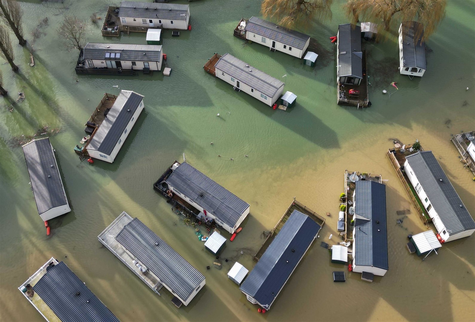 Holiday homes in Northampton surrounded by water after Storm Henk (Jacob King/PA)