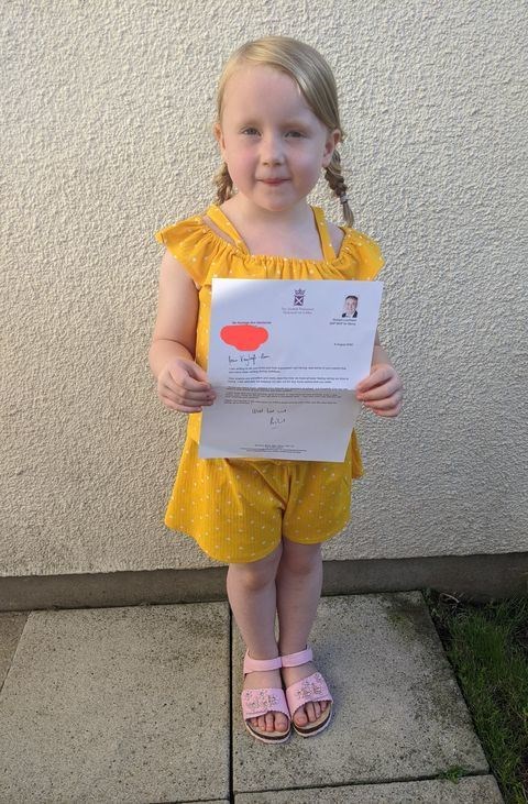 Kayleigh-Ann with the letter she received from Richard Lochhead.