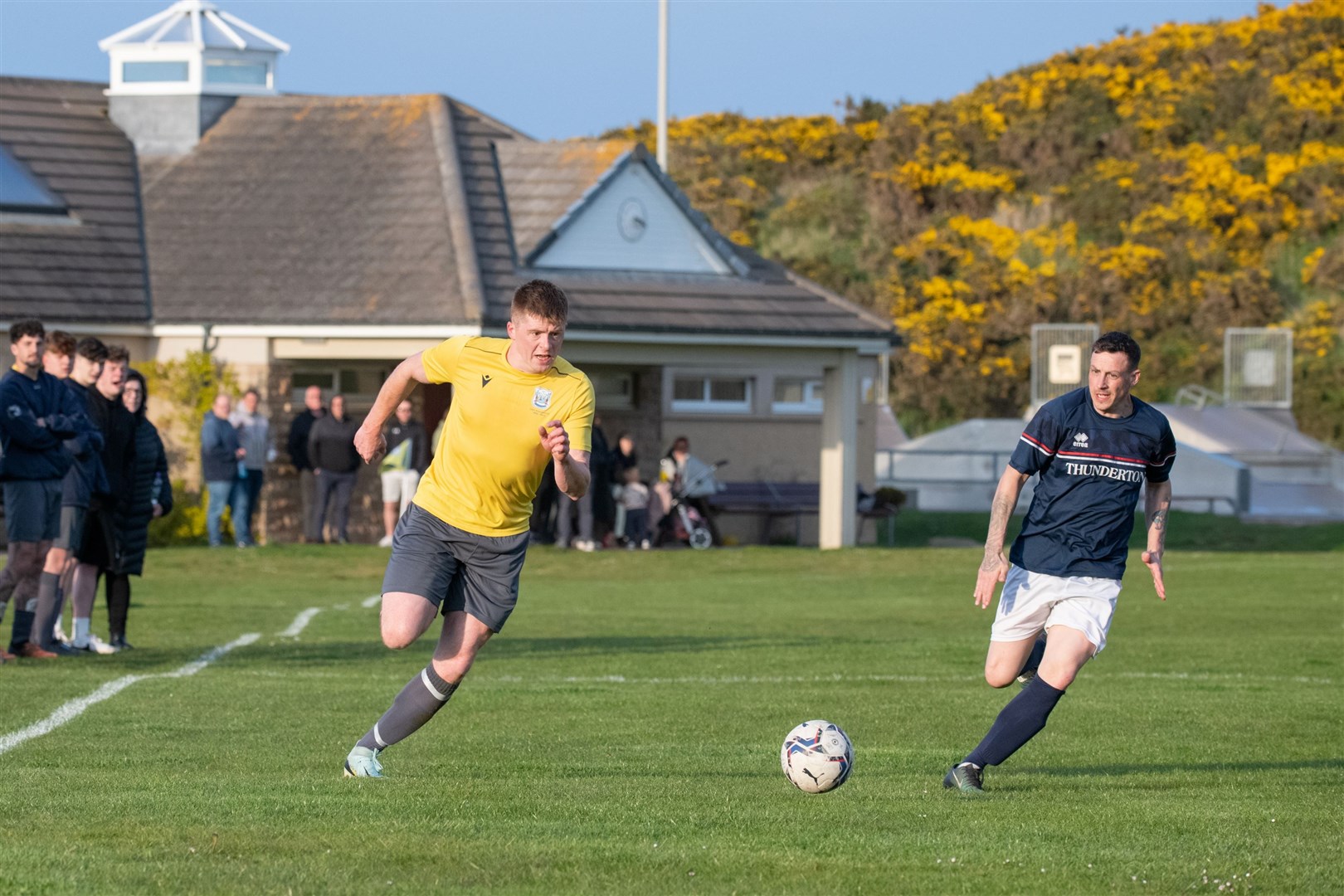 Hopeman's Matt Herley is tracked by Thunderton's Russell Geddes as he plays up the wingHopeman FC vs Thunderton FC - Moray Welfare League 2024. Picture: Daniel Forsyth.