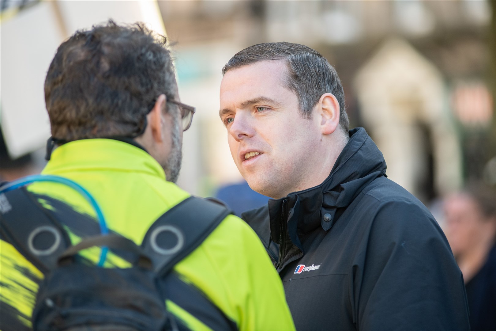 Moray's Conservative MP Douglas Ross speaks to a protester at the gathering. Picture: Daniel Forsyth