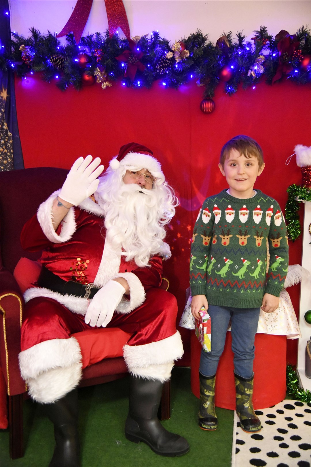 Santa with Noah Sinclair at his Grotto in the St Giles Centre in Elgin...Pictre: Beth Taylor.