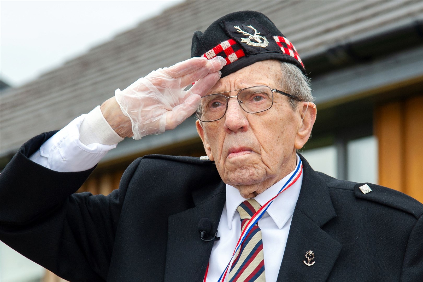 Donald Smith salutes in remembrance as the 80th anniversary of World War Two's Battle of St Valéry-en-Caux is commemorated. Picture: Daniel Forsyth