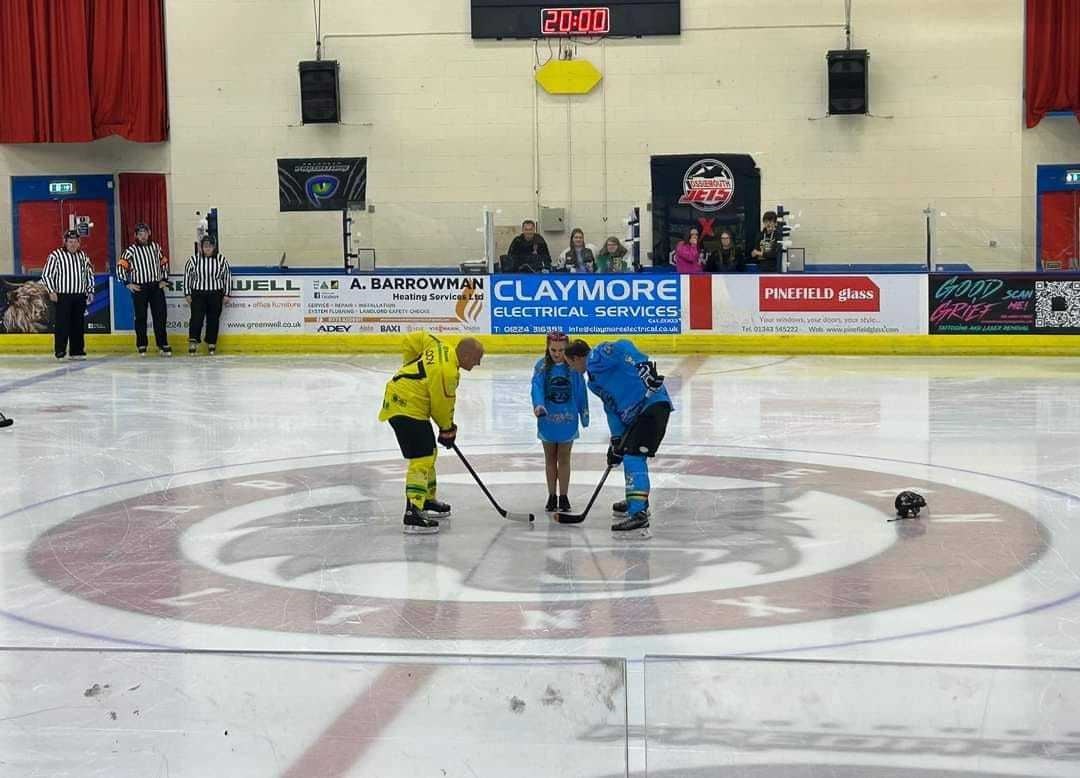 Lucy dropped the first puck on the ice before the match.