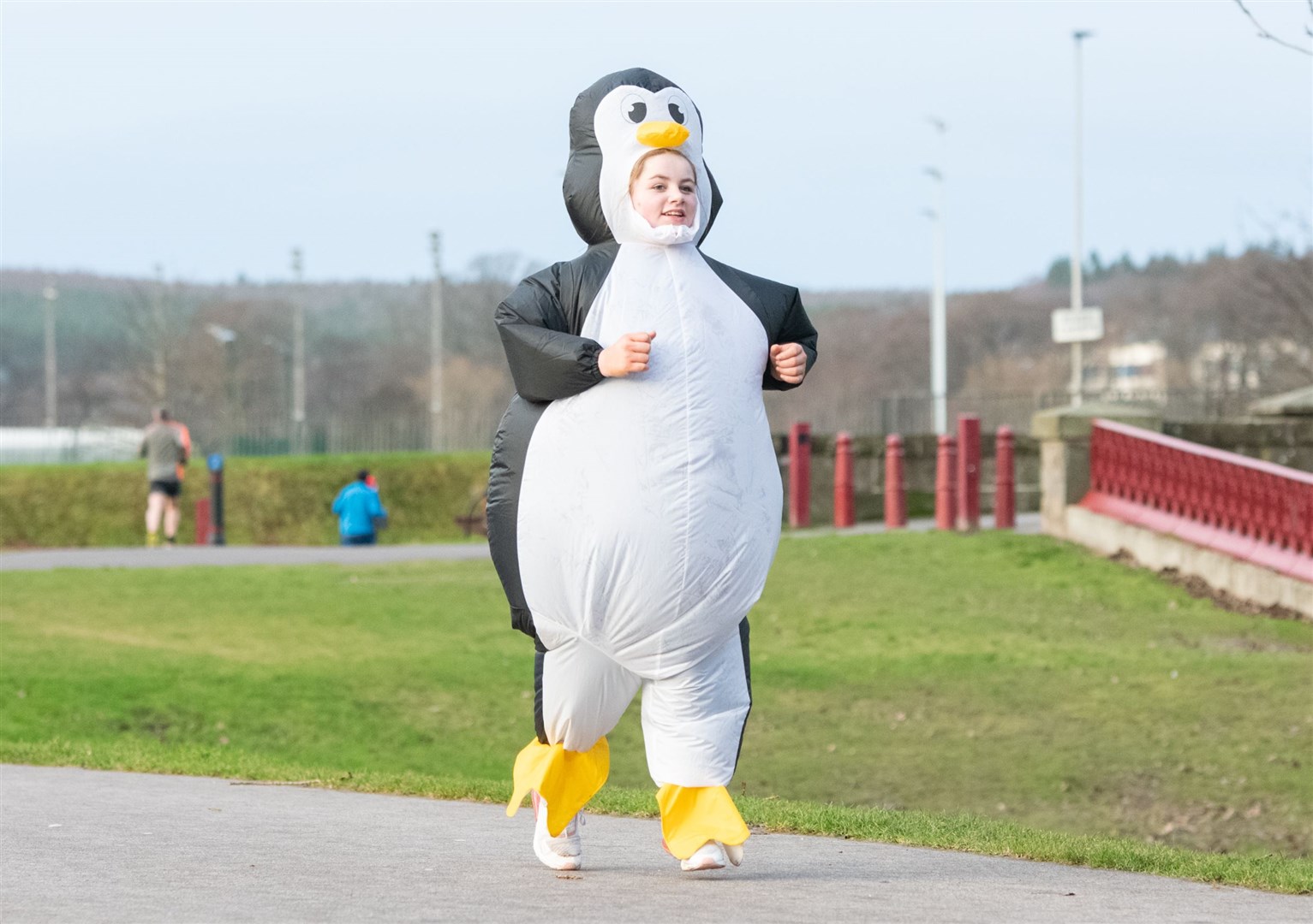 Chloe Munro, dressed as a penguin, was the 50,000th Elgin parkrun finisher since the start of the run...Elgin Christmas Day parkrun 2023...Picture: Daniel Forsyth..