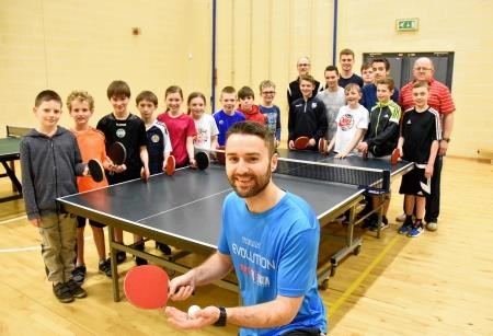 Coach Stephen Gertsen with some of the youngsters and volunteer helpers at Elgin Table Tennis Club at Elgin Academy. Picture: Becky Saunderson. Image No.040454