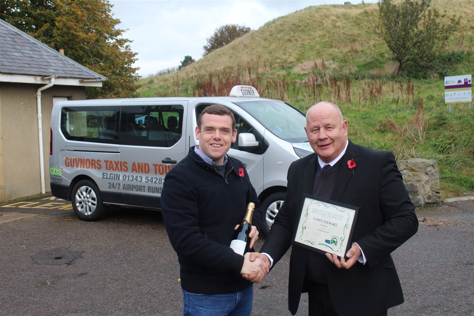 Elgin Taxi driver Garey Stewart, who owns Guvnor's Taxis, was presented with his award by Moray MP Douglas Ross.