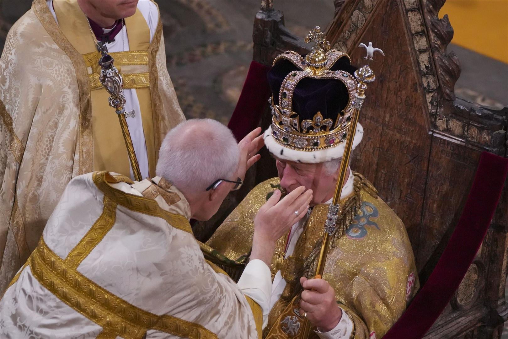 The King is crowned with St Edward’s Crown by the Archbishop of Canterbury (Aaron Chown/PA)