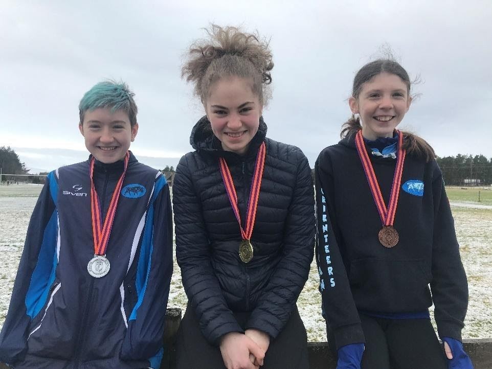 Isobel Howard (centre) claimed two medals at the British Orienteering Championships.