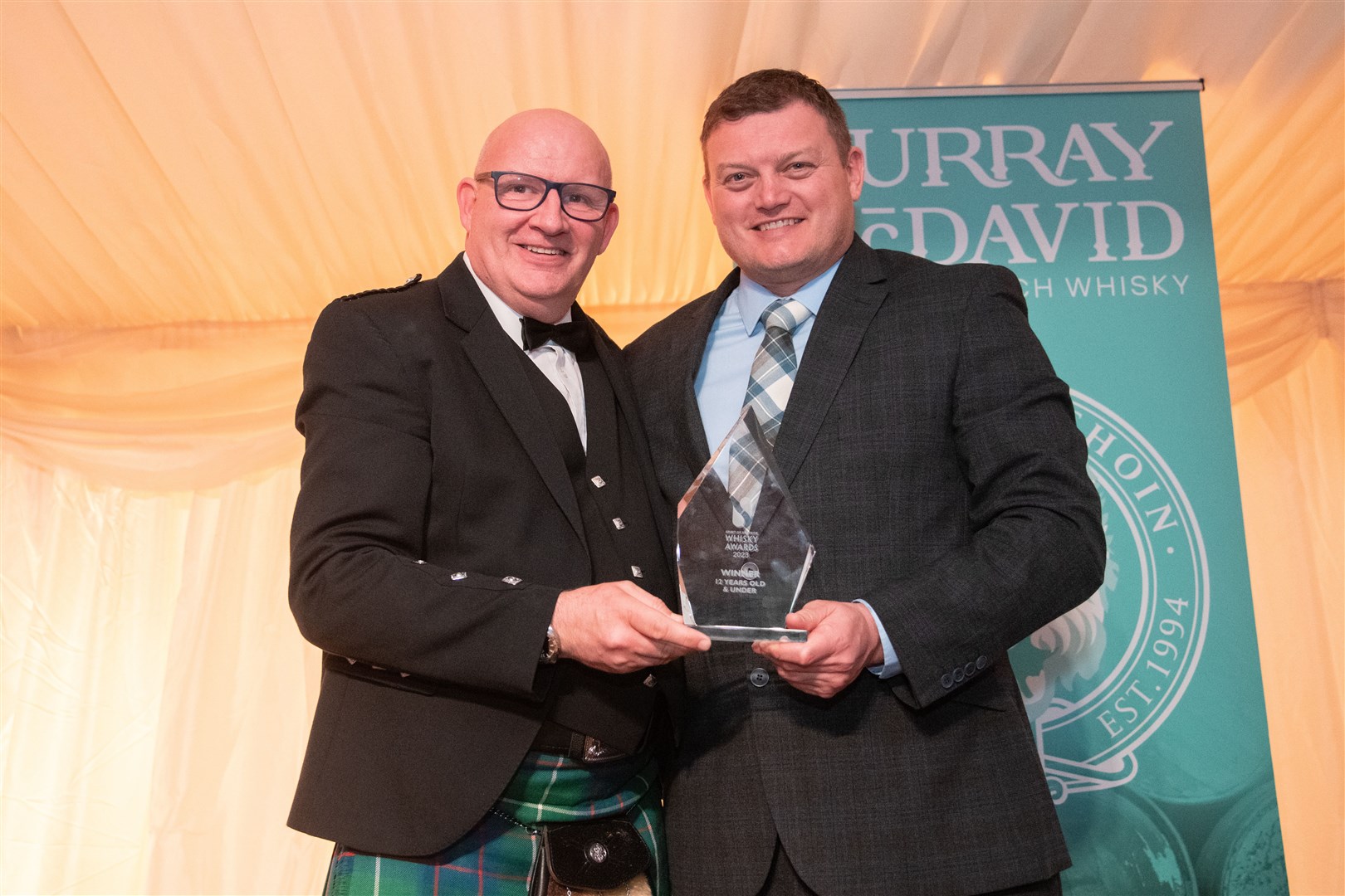 Winner of the 12 years old and under award was the Tamdhu 12-year-old. Collected by Distillery Manager Sandy McIntyre (left) and presented by Richard Forsyth...2023 Spirit of Speyside Whisky Festival Opening Dinner, held at Dallas Dhu Distillery...Picture: Daniel Forsyth..