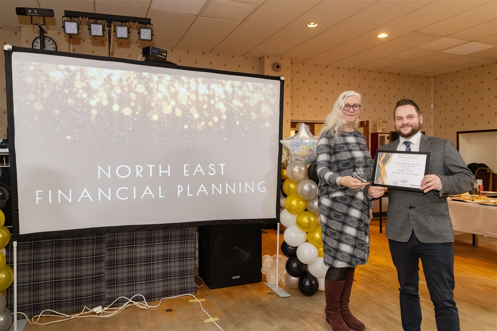 Lee Midlane presenting the local professional services award to North East Financial Planning's Darren MacDonald.