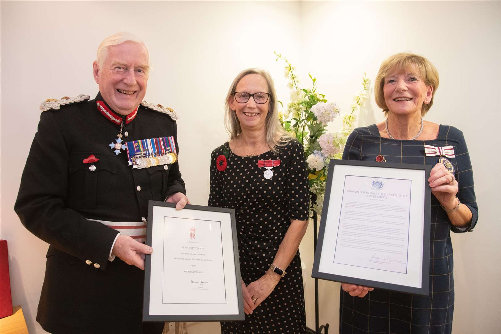 Liz Tait (centre) receives her British Empire Medal (BEM) from Lord Lieutenant of Moray Seymour Monro (left) and Deputy Lieutenant of Moray Margaret Stenton. Picture: Daniel Forsyth
