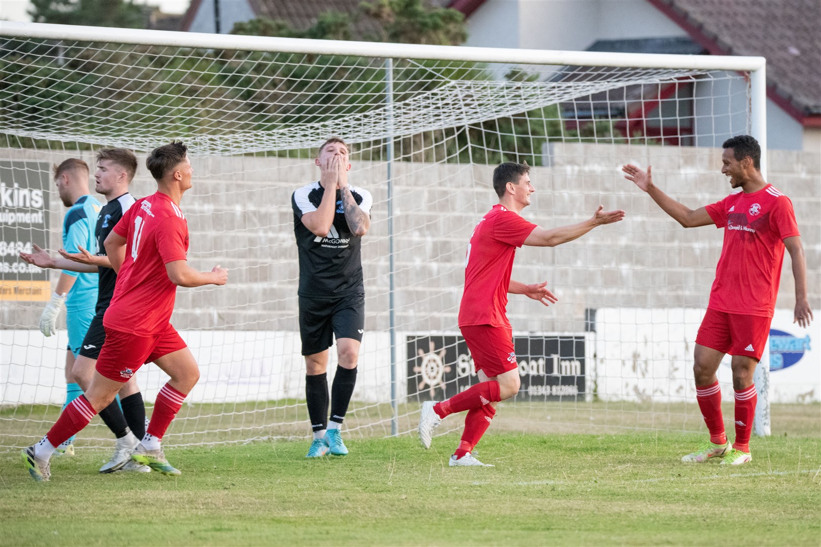 Lossiemouth captain Liam Archibald (centre right) wheels away to celebrate his opener...Lossiemouth FC (4) vs Strathspey Thistle (2) - Highland Football League 22/23 - Grant Park, Lossiemouth 24/08/2022...Picture: Daniel Forsyth..