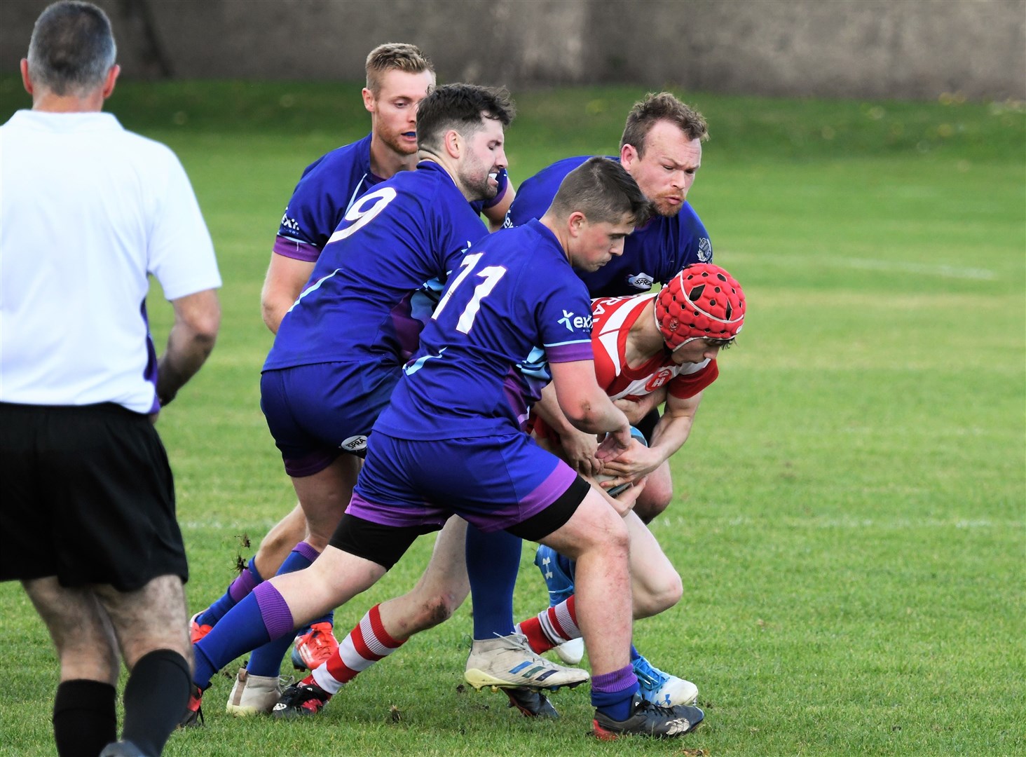 Lewis Hay drives on with defenders trying to tackle him. Picture: James Officer